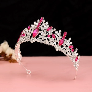 Detail view of pink crystal crown with silver leaves for wedding and stage party