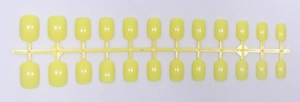 Detail view of 24 pieces short square lemon yellow glossy press-on nails on the mold