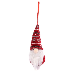Red knitted Christmas gnome hanging ornament with white faux fur beard on white background