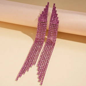 Close-up of pink rhinestone long tassel earrings featuring layered sparkling metal chains