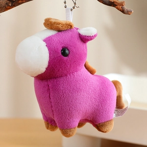 Detail of purple plush pony keychain with soft brown mane and metal ball chain