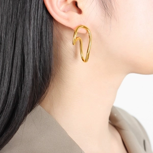 Minimalist gold irregular curved hoop earrings with abstract metallic textured finish