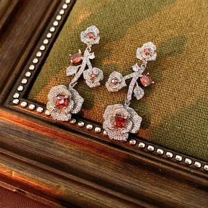Vintage rose drop earrings with red zircon stones and silver metal base design