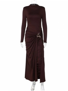 Detail of waist draping with silver metal buckle on a deep burgundy maxi dress