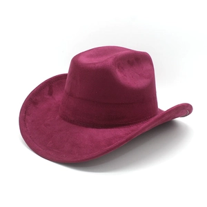 Detail of burgundy suede western cowboy hat with wide brim and creased crown crown