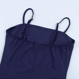 Close-up of adjustable straps and elastic neckline on a dark blue bodycon dress