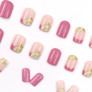 Sweet pink press-on nails set with fresh lemon patterns and glossy finish for women