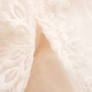 Bohemian elegant tiered lace skirt with delicate cream-white leaf embroidery detail