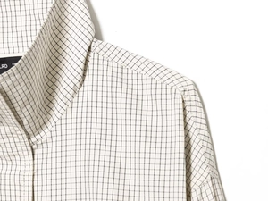 Detail shot of black and white plaid nylon shirt neckline and stitching quality