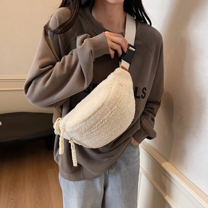 Minimalist cream plush crossbody fanny pack with white strap and woven zipper pull