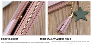 Detail of smooth golden zipper with pink leather tassel and star charm on wallet