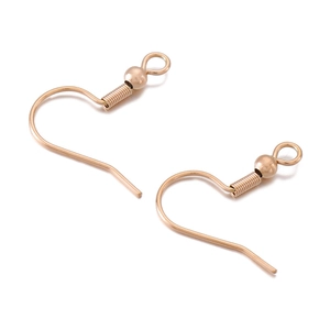 Close-up of gold-plated stainless steel earring hooks with spring and bead details