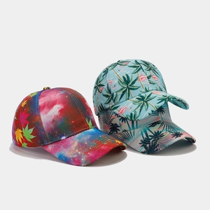Detail of printed baseball caps showing tropical flamingo and star maple patterns