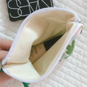 Interior view of the cactus print cotton pouch showing capacity for small cosmetics