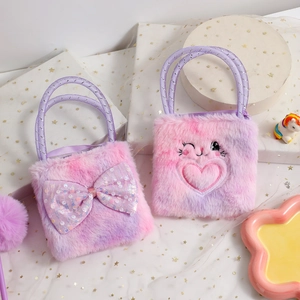Close-up of pink plush bunny bag featuring sequin bow and heart embroidery details