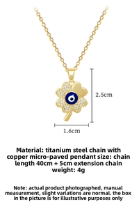 Detail of four-leaf clover lucky eye pendant with pavé cubic zirconia on gold chain