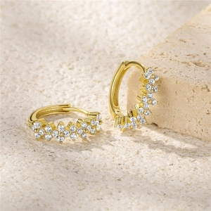Close-up of S925 sterling silver gold-plated hoop earrings with sparkling zircon stones