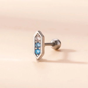 Macro detail of silver hexagonal ear stud featuring gradient blue and white zircon stones