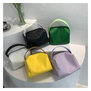 Chic trapezoid PU leather handbags shown in black green white yellow and purple