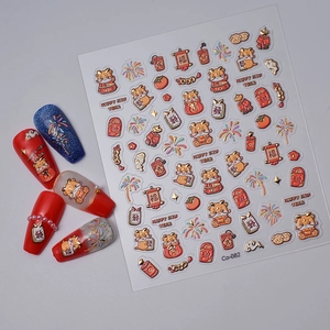 Detail of Lunar New Year nail stickers with gold foil dragon, koi fish and lucky charms
