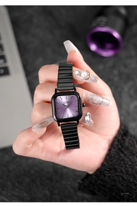 Detailed close-up of a square purple sunray dial watch with a black metal bamboo band