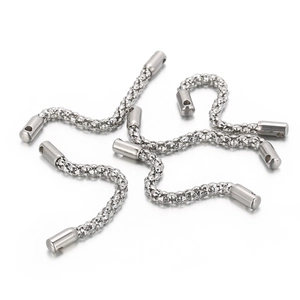 Macro shot of silver stainless steel corn chain connectors with polished end caps