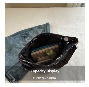 Interior view showing the large capacity of the tote bag with items and skull lining