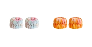 Macro shot of two pairs of soft plush bow wristbands in rainbow and orange gradient colors