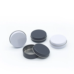Detailed close-up of 20g round tin containers in white and grey for cosmetic balm samples