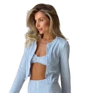 Three-piece light blue ribbed loungewear set with cardigan, crop top, and shorts