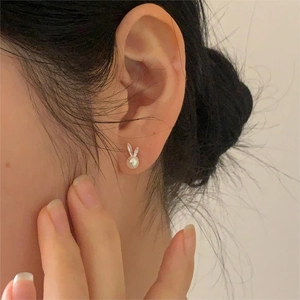 Elegant 925 sterling silver bunny pearl stud earrings with a polished metallic finish