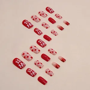 Christmas press-on nails set with red hearts, glitter gradients and HO HO holiday designs