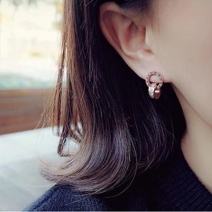 Rose gold roman numeral double ring stud earrings with sparkling cubic zirconia stones