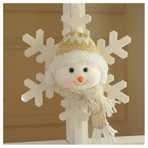 Detail of plush snowman ornament with knitted hat and felt snowflake decoration