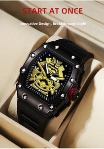 Detail of tonneau-shaped sports watch with golden samurai mask dial in a premium display box