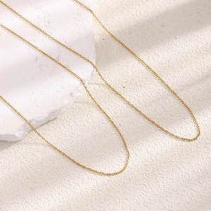 Minimalist 18K gold plated stainless steel 1.8mm O-chain necklace on white stone