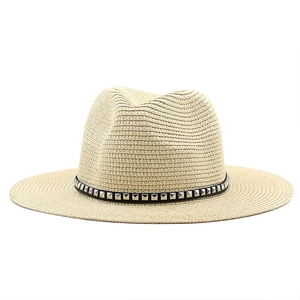 Beige straw fedora with metallic rivets and wide brim for sun protection and beach wear
