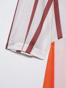 Detailed macro shot showing striped cotton-linen fabric texture with vibrant color blocks