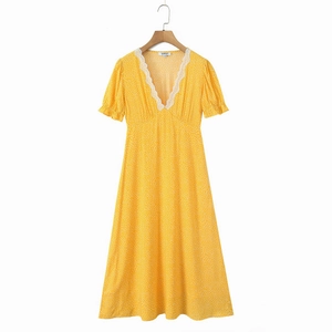 Chic yellow polka dot dress with V-neck lace trim and puff sleeves on white background