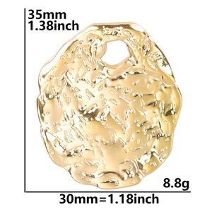 Detail of gold irregular oval pendant showing hammer texture and dimensions 35mm by 30mm
