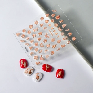 5D embossed Christmas nail stickers featuring gingerbread man and gold snowflake patterns