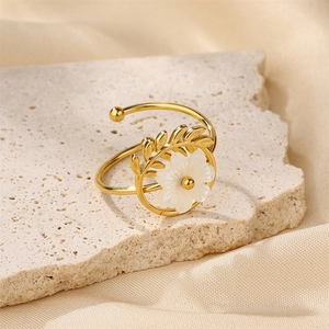 18K gold-plated stainless steel flower ring with white petals and golden leaves on stone
