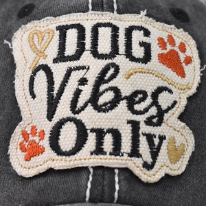 Macro detail of DOG Vibes Only embroidery patch on washed cotton baseball cap