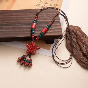 Bohemian ceramic necklace with red starfish pendant and colorful beads on woven rope