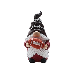 Resin football gnome statue with a football-textured hat and red clothes on white background