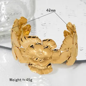 Statement gold floral bangle with relief flower design, 42mm inner diameter and 45g weight