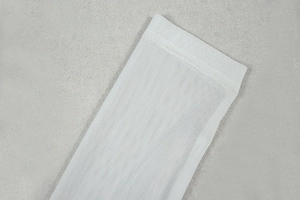 Detail of white mesh sleeve texture showing breathable semi-transparent fabric and stitching