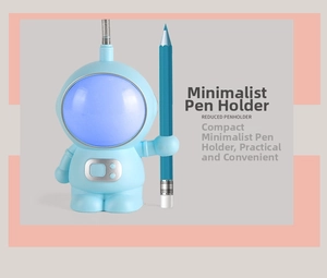 Detail view of the astronaut LED lamp showing the integrated pen holder and blue finish