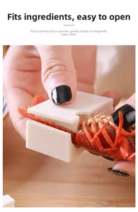 Close-up of white plastic crayfish sheller tool demonstrating easy shrimp deveining process
