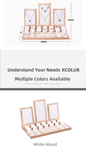 Detailed view of wooden jewelry display set with white leather inserts for necklaces and rings